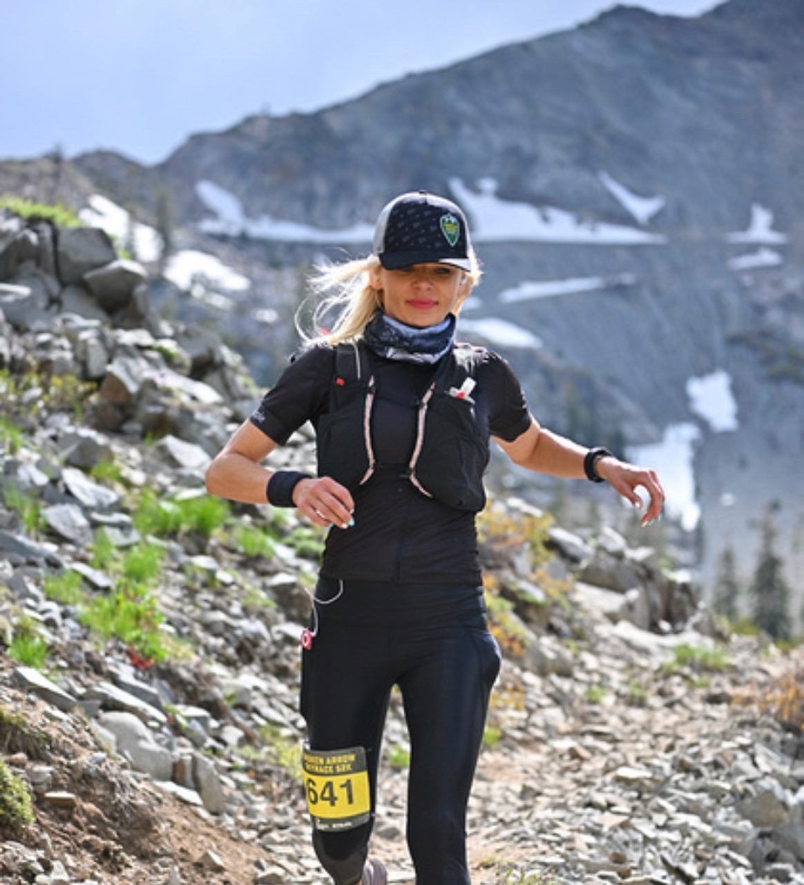 Juliana trail running on a rocky mountain course